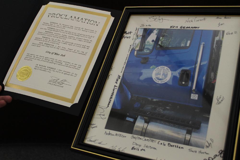 proclamation and photo of Blue Ash truck surrounded by signatures